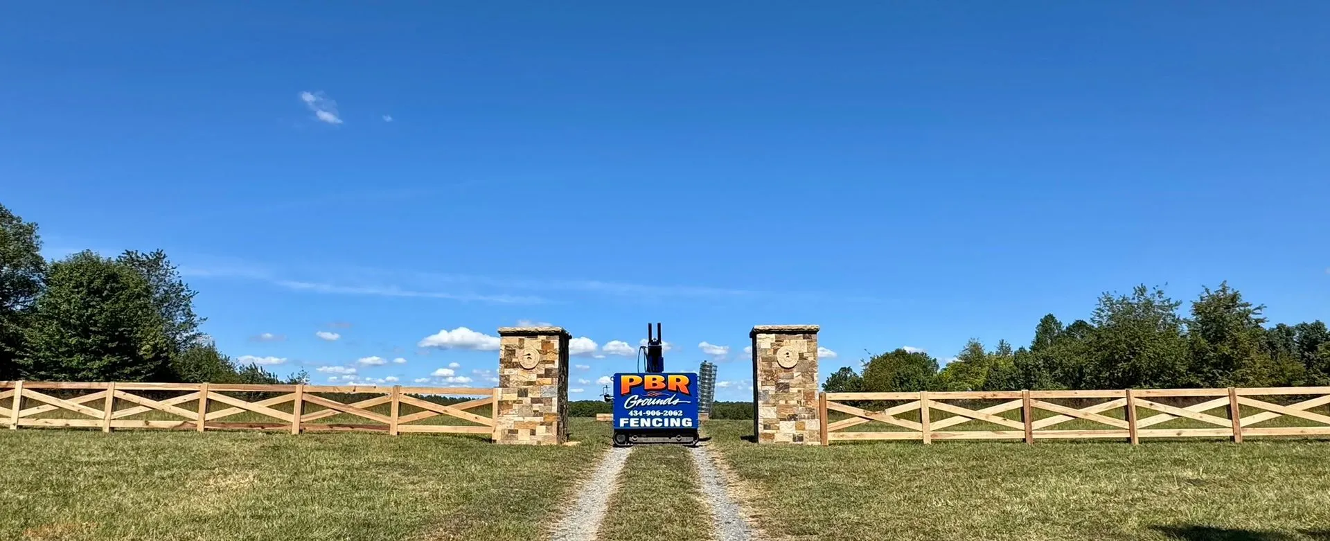PBR Grounds stone entry fence with post driver